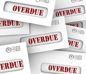 Overdue word in envelopes to illustrate bills that are late in payment and creditors hitting you with penalties and fees
